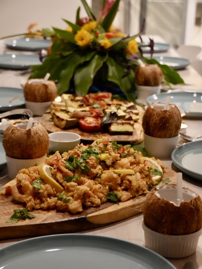 rice and prawns served on a wooden board