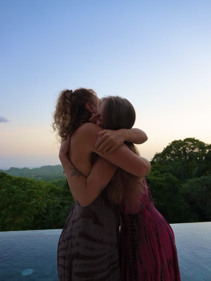 two women holding each other at the end of the week